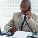 depositphotos 10337958 stock photo smiling entrepreneur making a phone