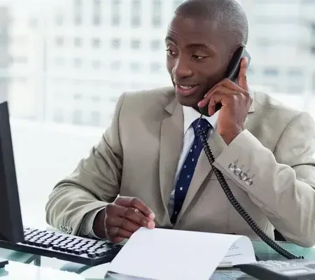 depositphotos 10337958 stock photo smiling entrepreneur making a phone